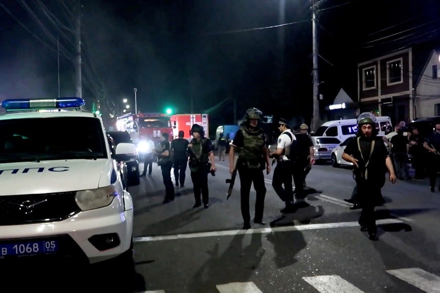 Law enforcement officers work in the street after an attack by gunmen in Makhachkala in the region of Dagestan, Russia, in this still image from video released June 24, 2024. National Antiterrorism Committee/Handout via REUTERS THIS IMAGE HAS BEEN SUPPLIED BY A THIRD PARTY. NO RESALES. NO ARCHIVES. MANDATORY CREDIT.