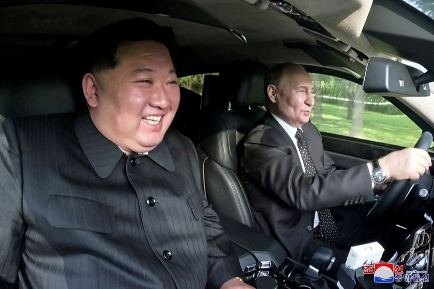 Russia's President Vladimir Putin and North Korea's leader Kim Jong Un ride an Aurus car in Pyongyang, North Korea in this image released by the Korean Central News Agency June 20, 2024.    KCNA via REUTERS    ATTENTION EDITORS - THIS IMAGE WAS PROVIDED BY A THIRD PARTY. REUTERS IS UNABLE TO INDEPENDENTLY VERIFY THIS IMAGE. NO THIRD PARTY SALES. SOUTH KOREA OUT. NO COMMERCIAL OR EDITORIAL SALES IN SOUTH KOREA.     TPX IMAGES OF THE DAY