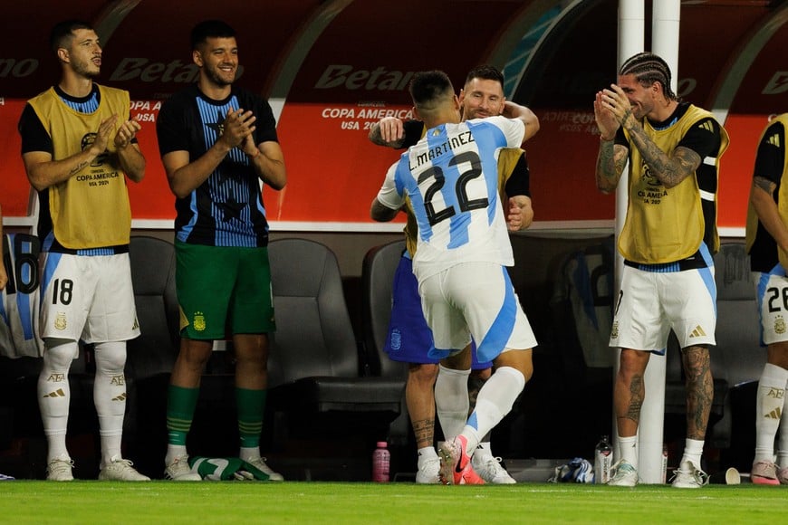 Jun 29, 2024; Miami, FL, USA;  forward Lautaro Martínez (22) celebrates with forward Lionel Messi (10) after scoring a goal against Peru in the second half during the Copa America group stage at Hard Rock Stadium. Mandatory Credit: Nathan Ray Seebeck-USA TODAY Sports