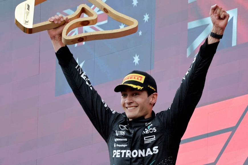 Formula One F1 - Austrian Grand Prix - Red Bull Ring, Spielberg, Austria - June 30, 2024
Mercedes' George Russell celebrates with the trophy on the podium after winning the Austrian Grand Prix REUTERS/Leonhard Foeger