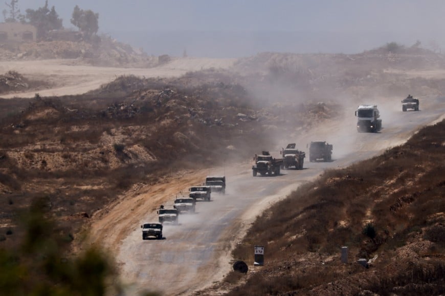 An Israeli military convoy moves inside the Gaza Strip, amid the ongoing conflict between Israel and Hamas, as seen from Israel, June 17, 2024. REUTERS/Amir Cohen     TPX IMAGES OF THE DAY