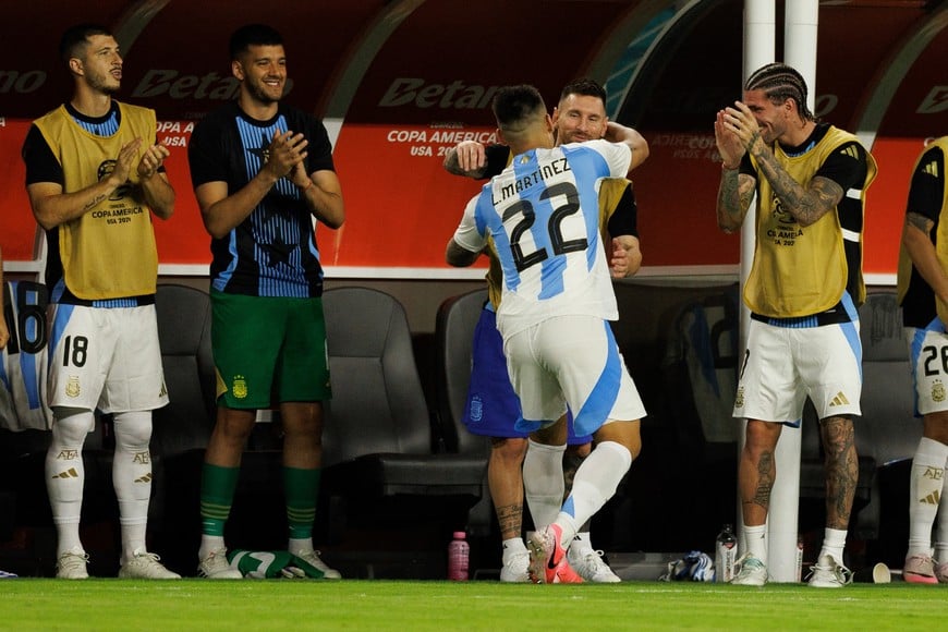 Jun 29, 2024; Miami, FL, USA;  Argentina forward Lautaro Martínez (22) celebrates with forward Lionel Messi (10) after scoring a goal against Peru in the second half during the Copa America group stage at Hard Rock Stadium. Mandatory Credit: Nathan Ray Seebeck-USA TODAY Sports
