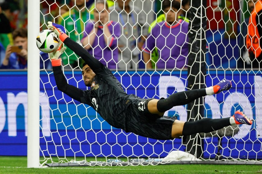Soccer Football - Euro 2024 - Round of 16 - Portugal v Slovenia - Frankfurt Arena, Frankfurt, Germany - July 1, 2024 
Portugal's Diogo Costa saves a penalty during the shootout missed by Slovenia's Jure Balkovec REUTERS/Wolfgang Rattay     TPX IMAGES OF THE DAY