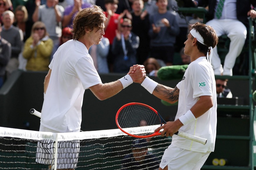 Tennis - Wimbledon - All England Lawn Tennis and Croquet Club, London, Britain - July 2, 2024
Australia's Francisco Comesana shakes hands with Russia's Andrey Rublev after winning his first round match REUTERS/Isabel Infantes