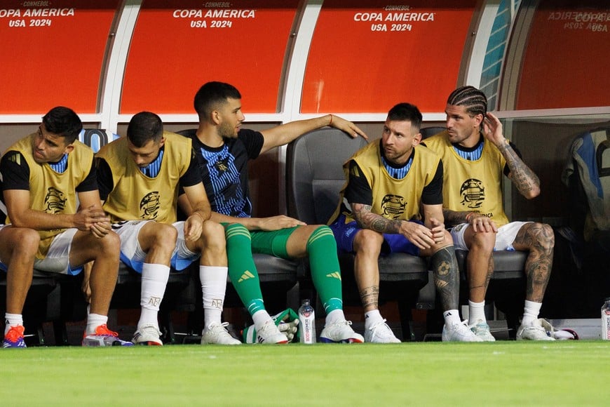 Jun 29, 2024; Miami, FL, USA;  Argentina forward Lionel Messi (10) looks on from the bench during a Copa America group stage match against Peru at Hard Rock Stadium. Mandatory Credit: Nathan Ray Seebeck-USA TODAY Sports