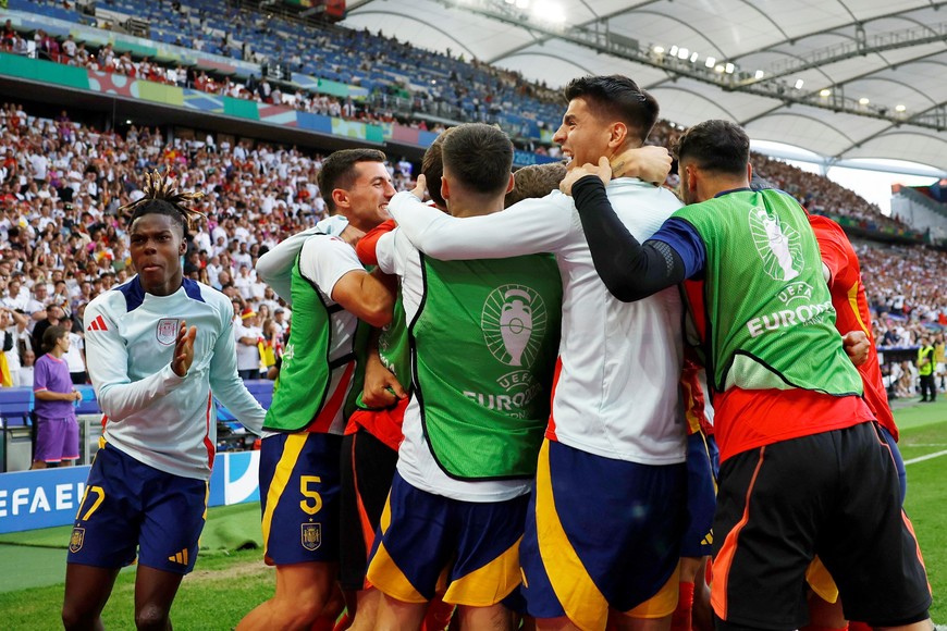 Soccer Football - Euro 2024 - Quarter Final - Spain v Germany - Stuttgart Arena, Stuttgart, Germany - July 5, 2024
Spain's Mikel Merino celebrates scoring their second goal with teammates REUTERS/Heiko Becker