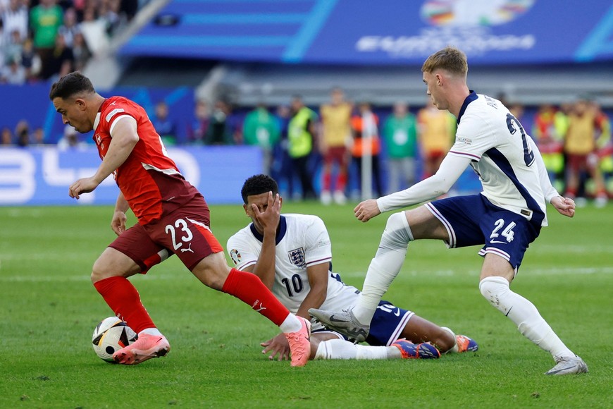 Soccer Football - Euro 2024 - Quarter Final - England v Switzerland - Dusseldorf Arena, Dusseldorf, Germany - July 6, 2024
Switzerland's Xherdan Shaqiri in action as England's Jude Bellingham reacts REUTERS/John Sibley