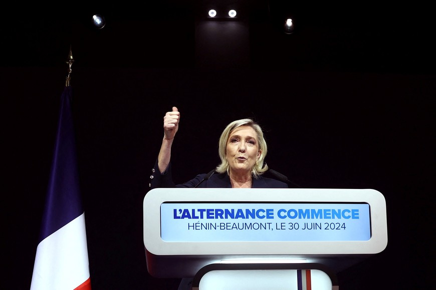 Marine Le Pen, French far-right leader and far-right Rassemblement National (National Rally - RN) party candidate, deliver a speech after partial results in the first round of the early French parliamentary elections in Henin-Beaumont, France, June 30, 2024. REUTERS/Yves Herman