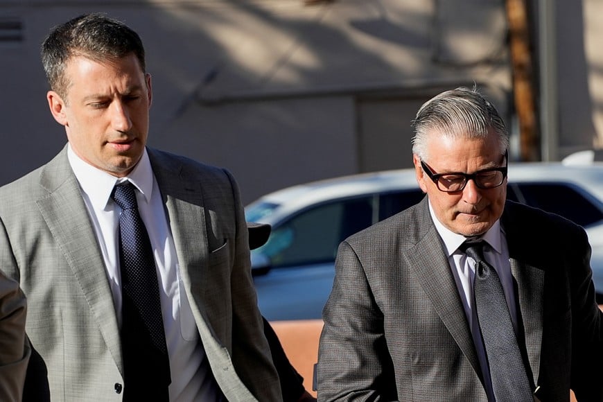 Actor Alec Baldwin and his lawyer Alex Spiro walk towards the courthouse, as jury selection begins in Alec Baldwin's manslaughter trial for the 2021 fatal shooting of cinematographer Halyna Hutchins during the filming of the Western movie "Rust", in Santa Fe, New Mexico, U.S. July 9, 2024. REUTERS/Ramsay de Give