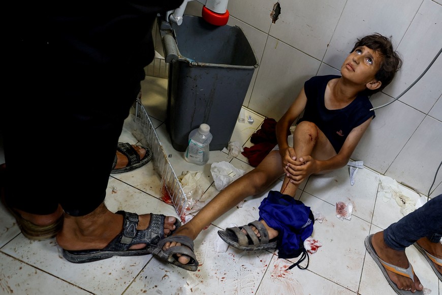 A Palestinian boy looks on at Nasser hospital, following an Israeli strike, amid the Israel-Hamas conflict, in Khan Younis, in the southern Gaza Strip, July 9, 2024. REUTERS/Mohammed Salem