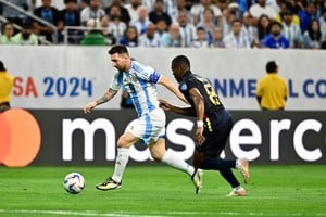 Jul 4, 2024; Houston, TX, USA; Argentina's striker Lionel Messi (10) controls the ball as Ecuador's midfielder Carlos Gruezo (8) defends during the first half at NRG Stadium. Mandatory Credit: Maria Lysaker-USA TODAY Sports
