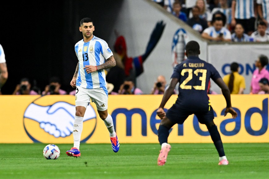 Jul 4, 2024; Houston, TX, USA; Argentina's defender Cristian Romero (13) looks to pass the ball during the first half against Ecuador at NRG Stadium. Mandatory Credit: Maria Lysaker-USA TODAY Sports