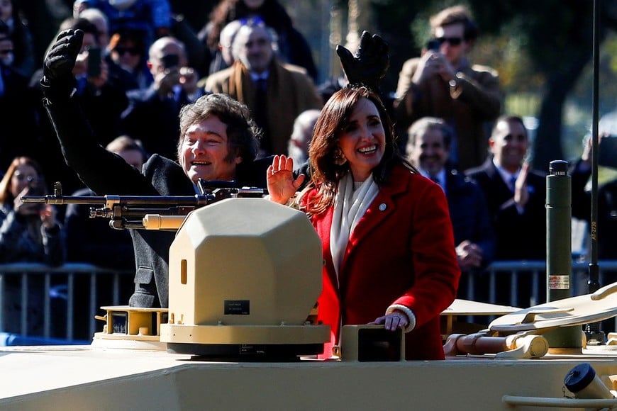 Argentina's President Javier Milei and Vice President Victoria Villarruel wave from a military vehicle during a military parade commemorating the 208th anniversary of the country's independence from Spain in 1816, in Buenos Aires, Argentina July 9, 2024. REUTERS/Matias Baglietto