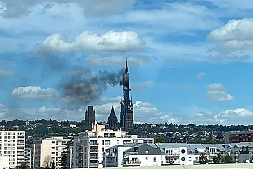 A view shows the spire of the gothic cathedral of the French city of Rouen in Normandy caught fire during renovation works, in Rouen, France, July 11, 2024. REUTERS/Jeremy Collado