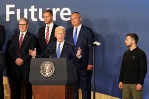 Prime Minister Sir Keir Starmer (left) and Ukrainian President Volodymyr Zelenskiy (right) look on as US President Joe Biden speaks, where he introduced Ukrainian president Volodymyr Zelensky as "President Putin" during the closing ceremony, at the Nato 75th anniversary summit at the Walter E. Washington Convention Center, in Washington DC, US. Picture date: Thursday July 11, 2024.  Stefan Rousseau/Pool via REUTERS