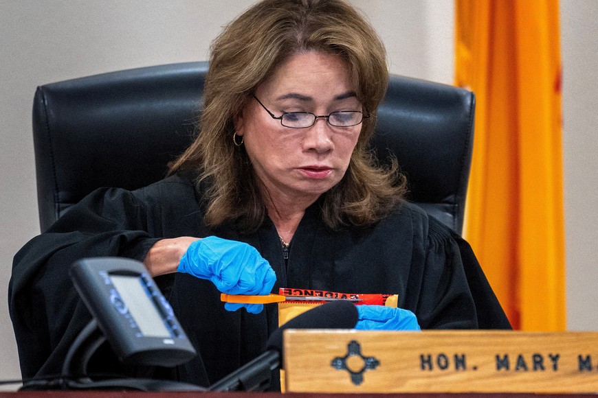 Judge Mary Marlowe Sommer opens a package of evidence not turned over to defence attorneys in the trial against Alec Baldwin, in Santa Fe, N.M. Friday, July 12, 2024. The charge of involuntary manslaughter, related to the death of cinematographer Halyna Hutchins during the filming of the movie Rust in 2021, were dropped and can not be refiled.    Eddie Moore / Journal/Pool via REUTERS