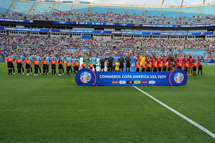 Jul 13, 2024; Charlotte, NC, USA; Teams from Canada and Uruguay take the field during the first half at Bank of America Stadium. Mandatory Credit: Jim Dedmon-USA TODAY Sports