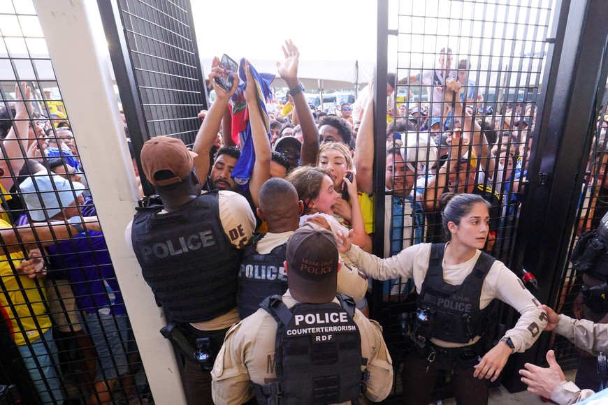 Jul 14, 2024; Miami, FL, USA;  fans rush the gates before the Copa America Final match between Argentina and Colombia at Hard Rock Stadium. Mandatory Credit: Nathan Ray Seebeck-USA TODAY Sports