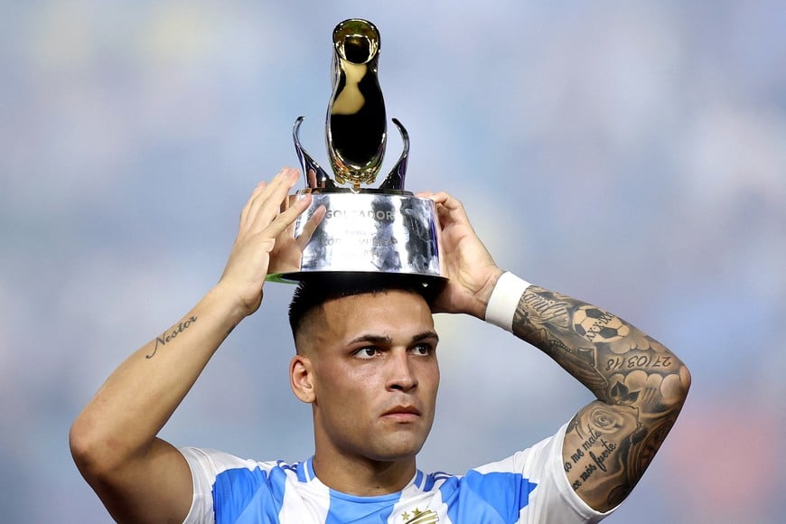 Soccer Football - Copa America 2024 - Final - Argentina v Colombia - Hard Rock Stadium, Miami, Florida, United States - July 14, 2024
Argentina's Lautaro Martinez celebrates with the golden boot trophy after the match REUTERS/Agustin Marcarian