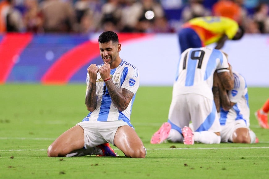 Jul 14, 2024; Miami, FL, USA;  Argentina defender Cristian Romero (13) celebrates after beating Colombia in the Copa America Final at Hard Rock Stadium. Mandatory Credit: Nathan Ray Seebeck-USA TODAY Sports