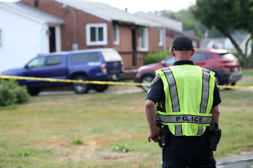 A Bethel Park police officer looks at the home of 20-year-old Thomas Matthew Crooks, named by the FBI as the "subject involved" in the attempted assassination of former President Donald Trump, in Bethel Park, Pennsylvania, U.S. July 15, 2024. REUTERS/Aaron Josefczyk