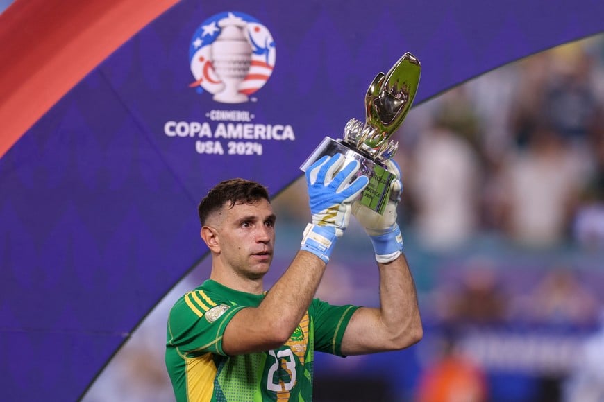 Jul 14, 2024; Miami, FL, USA; Argentina defender Lisandro Martinez (25) celebrates after winning the Copa America Final against Colombia at Hard Rock Stadium. Mandatory Credit: Nathan Ray Seebeck-USA TODAY Sports