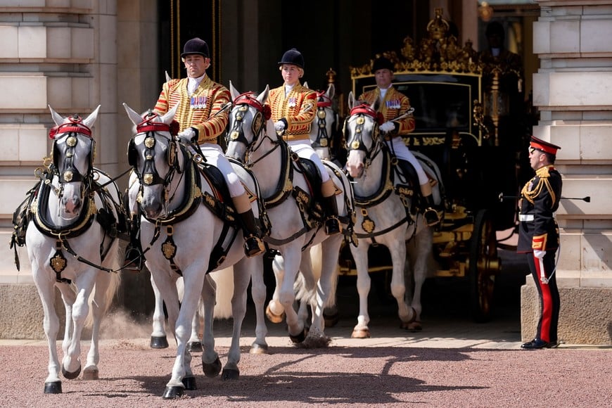 King Charles III and Queen Camilla travel in the Diamond Jubilee State Coach as they depart Buckingham Palace, London, to attend the State Opening of Parliament in the House of Lords at the Palace of Westminster, London. Picture date: Wednesday July 17, 2024. Andrew Matthews/Pool via REUTERS