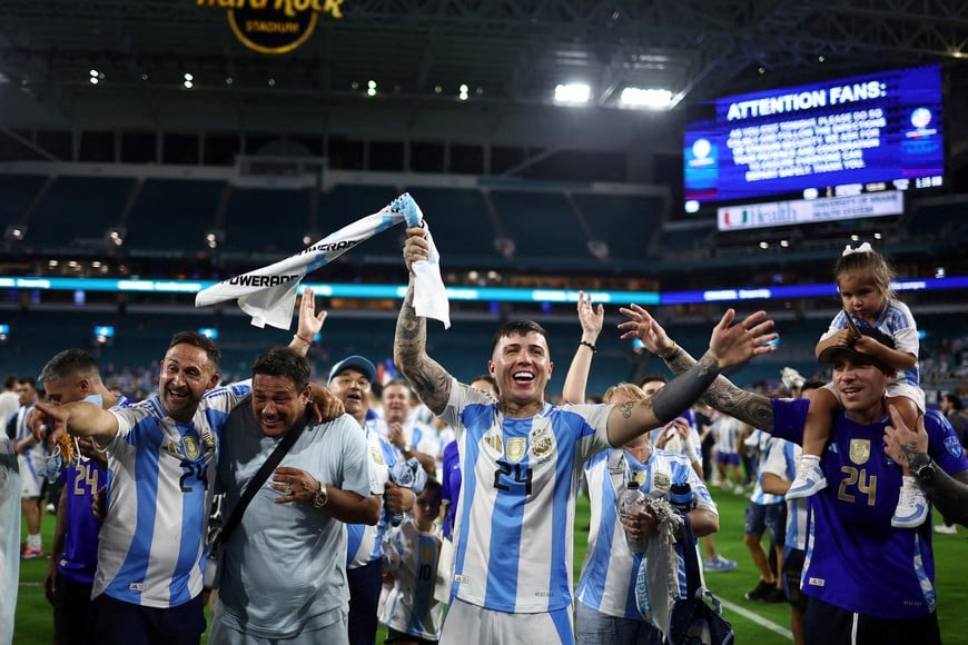 FILE PHOTO: Soccer Football - Copa America 2024 - Final - Argentina v Colombia - Hard Rock Stadium, Miami, Florida, United States - July 15, 2024
Argentina's Enzo Fernandez celebrates with family after winning the Copa America 2024 REUTERS/Agustin Marcarian/File Photo
