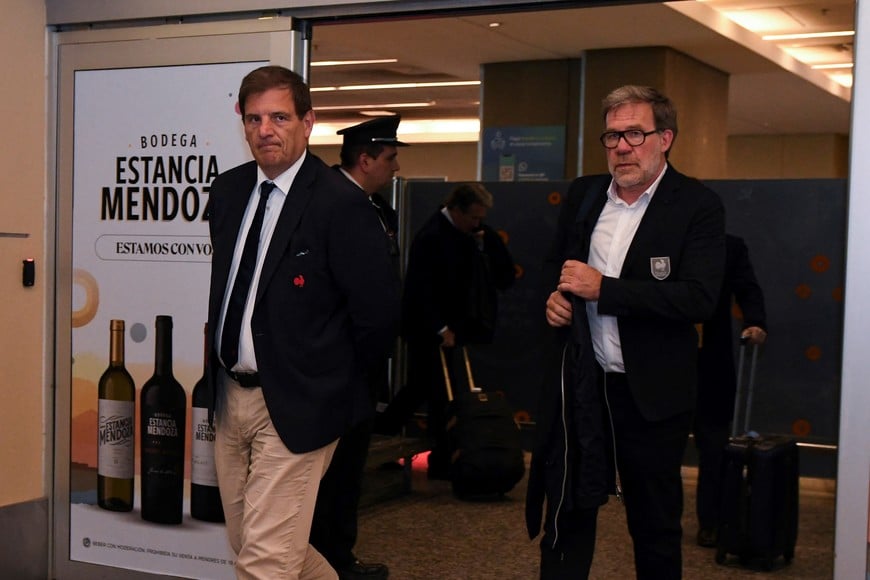 Florian Grill President of the French Federation of Rugby and Jean-Marc Lhermet, Vice-President walk outside the airport in Mendoza, Argentina July 10, 2024. REUTERS/Ramiro Gomez
