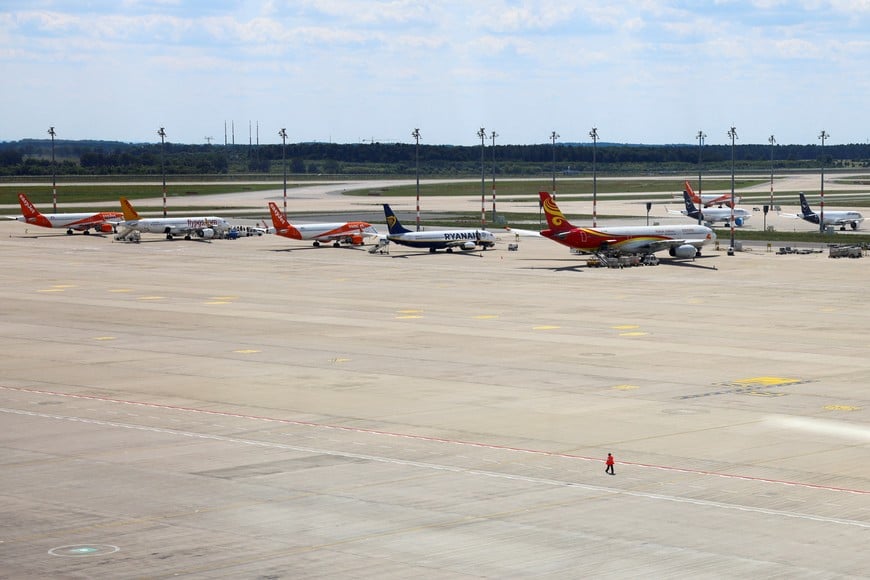 Airplanes are parked on the tarmac as people wait for their flights following a global IT outage, at BER airport in Berlin, Germany, July, 19, 2024. REUTERS/Nadja Wohlleben