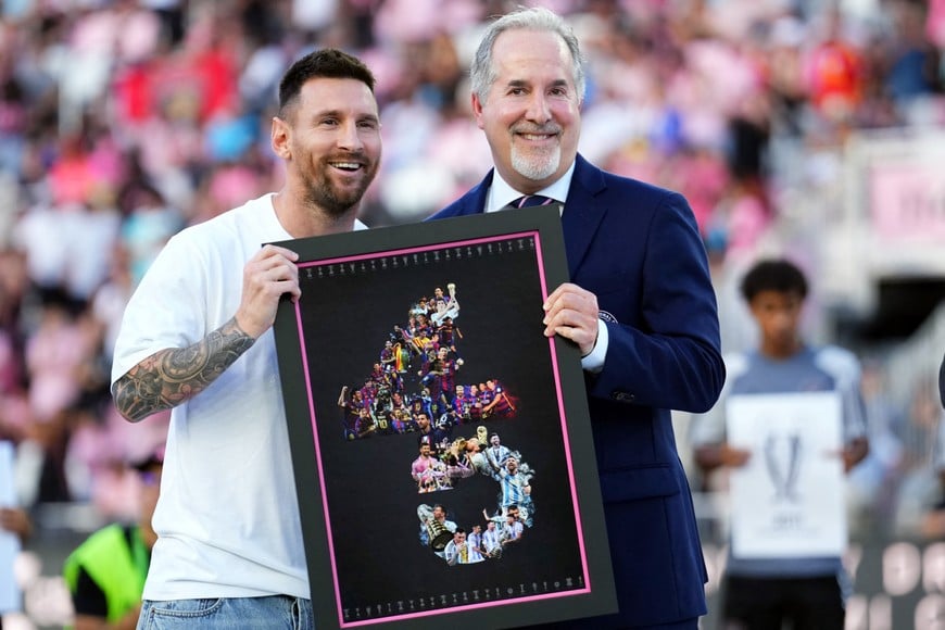 Jul 20, 2024; Fort Lauderdale, Florida, USA; Inter Miami CF owner Jorge Mas and forward Lionel Messi (10) smile during a ceremony to honor Messi after Argentina won the 2024 Copa America final before the match between Inter Miami CF and Chicago Fire FC at Chase Stadium. Mandatory Credit: Rich Storry-USA TODAY Sports