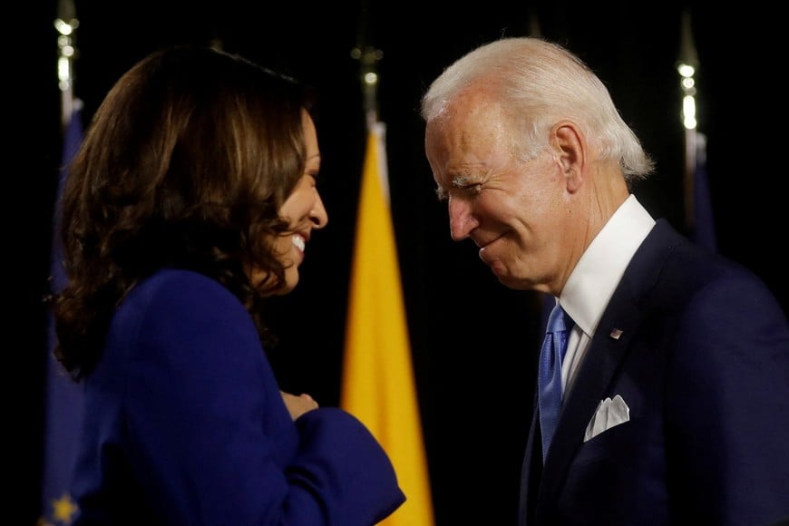 FILE PHOTO: Democratic presidential candidate and former Vice President Joe Biden and vice presidential candidate Senator Kamala Harris are seen at the stage during a campaign event, their first joint appearance since Biden named Harris as his running mate, at Alexis Dupont High School in Wilmington, Delaware, U.S., August 12, 2020. REUTERS/Carlos Barria/File Photo