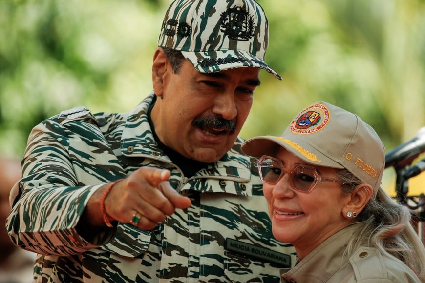 Venezuela's President Nicolas Maduro and his wife Cilia Flores attend an event, in Caracas, Venezuela April 13, 2024. REUTERS/Leonardo Fernandez Viloria
