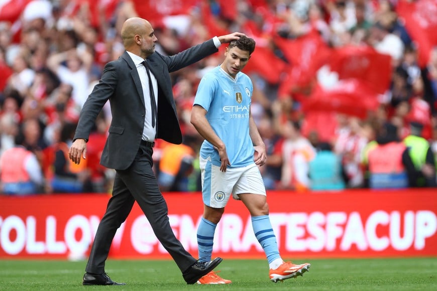 Soccer Football - FA Cup - Final - Manchester City v Manchester United - Wembley Stadium, London, Britain - May 25, 2024
Manchester City manager Pep Guardiola and Julian Alvarez look dejected after the match REUTERS/Hannah Mckay