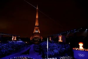 Paris 2024 Olympics - Opening Ceremony - Paris, France - July 26, 2024. A general view shows the Olympic rings illuminated on the Eiffel Tower during the opening ceremony of the Paris 2024 Olympic Games in Paris on July 26, 2024.     LUDOVIC MARIN/Pool via REUTERS
