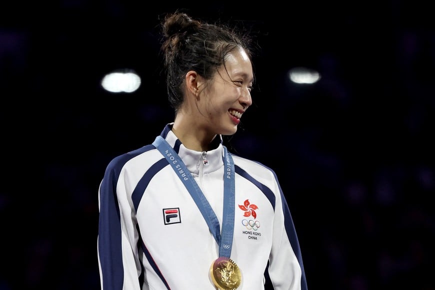 Paris 2024 Olympics - Fencing - Women's Epee Individual Victory Ceremony - Grand Palais, Paris, France - July 27, 2024.
Gold medalist Man Wai Vivian Kong of Hong Kong celebrates with her medal in the Women's Epee Fencing. REUTERS/Maye-E Wong