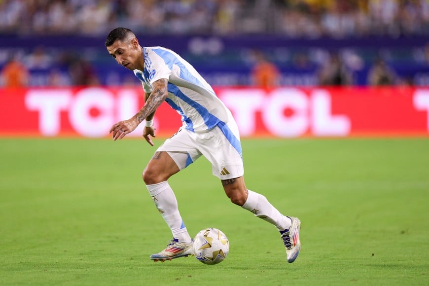 Jul 14, 2024; Miami, FL, USA; Argentina midfielder Angel Di Maria (11) controls the ball against Colombia in the second half during the Copa America Final at Hard Rock Stadium. Mandatory Credit: Nathan Ray Seebeck-USA TODAY Sports