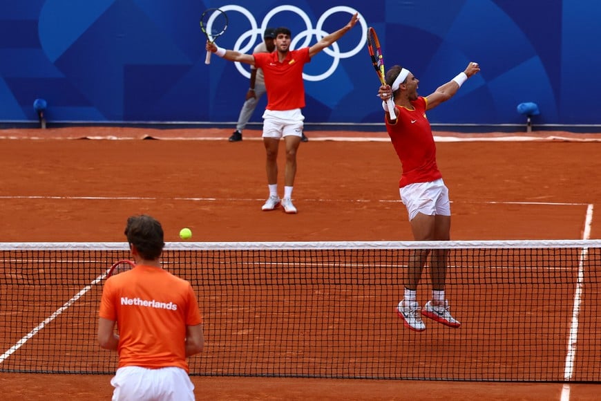 Paris 2024 Olympics - Tennis - Men's Doubles Second Round - Roland-Garros Stadium, Paris, France - July 30, 2024.
Carlos Alcaraz of Spain and Rafael Nadal of Spain celebrate after winning their match against Tallon Griekspoor of Netherlands and Wesley Koolhof of Netherlands. REUTERS/Edgar Su