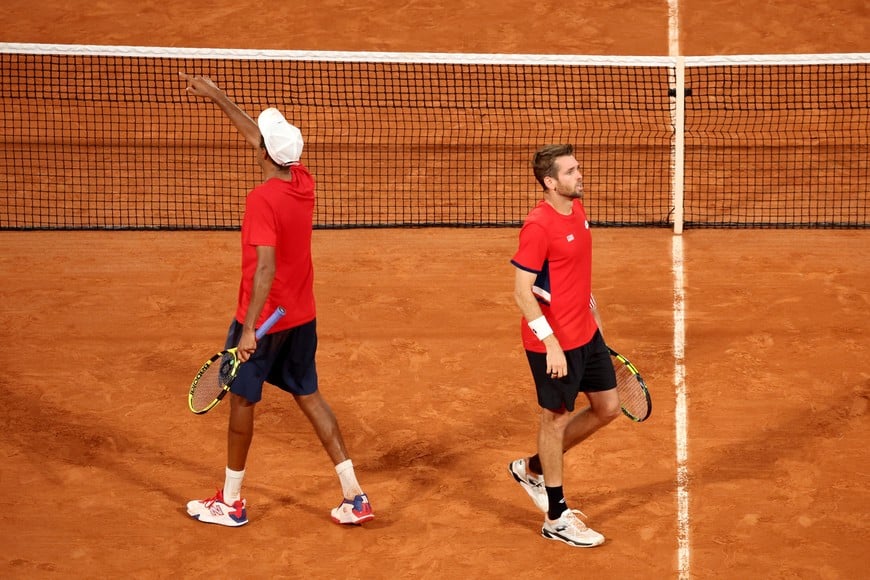 Paris 2024 Olympics - Tennis - Men's Doubles Quarterfinals - Roland-Garros Stadium, Paris, France - July 31, 2024.
Austin Krajicek of United States and Rajeev Ram of United States celebrate after winning their match against Carlos Alcaraz of Spain and Rafael Nadal of Spain. REUTERS/Phil Noble