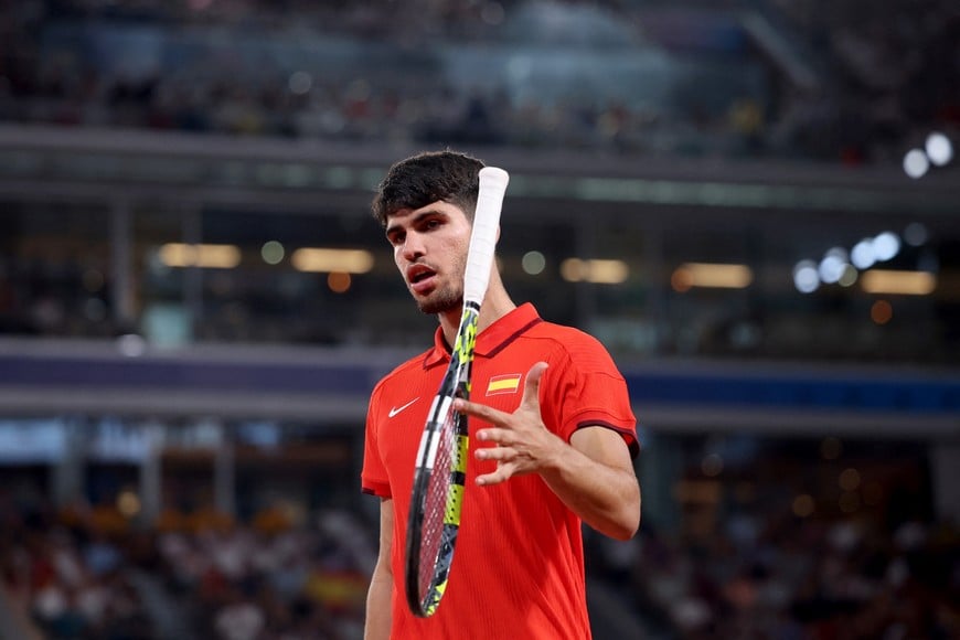 Paris 2024 Olympics - Tennis - Men's Doubles Quarterfinals - Roland-Garros Stadium, Paris, France - July 31, 2024.
Carlos Alcaraz of Spain reacts during his match with Rafael Nadal of Spain against Austin Krajicek of United States and Rajeev Ram of United States. REUTERS/Claudia Greco