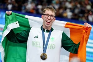 Paris 2024 Olympics - Swimming - Men's 800m Freestyle Victory Ceremony - Paris La Defense Arena, Nanterre, France - July 30, 2024. 
Gold medallist Daniel Wiffen of Ireland celebrates after winning and setting a new Olympic record. REUTERS/Ueslei Marcelino