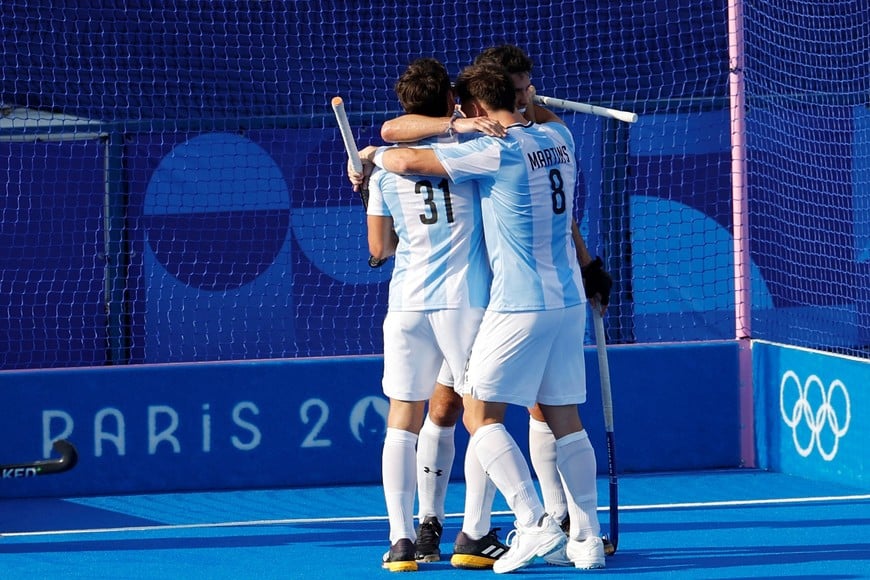 Paris 2024 Olympics - Hockey - Men's Pool B - Belgium vs Argentina - Yves-du-Manoir Stadium, Colombes, France - August 02, 2024.
Bautista Capurro Zubeldia of Argentina and Tobias Martins of Argentina celebrate their third goal. REUTERS/Adnan Abidi