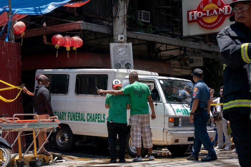 A vehicle transports the victims of a fire at a building, in Manila, Philippines, August 2, 2024. REUTERS/Lisa Marie David
