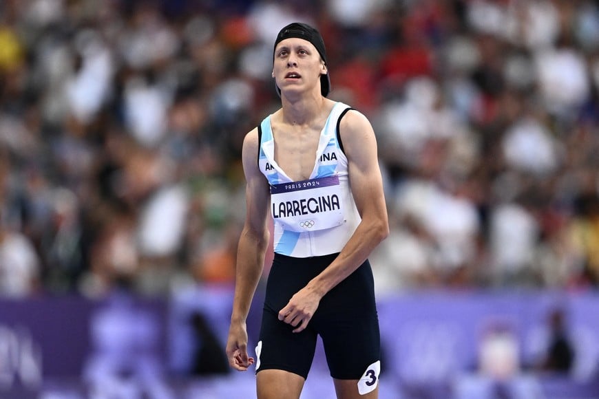 Paris 2024 Olympics - Athletics - Men's 400m Round 1 - Stade de France, Saint-Denis, France - August 04, 2024.
Elian Larregina of Argentina reacts after finishing heat 4 in sixth place REUTERS/Dylan Martinez