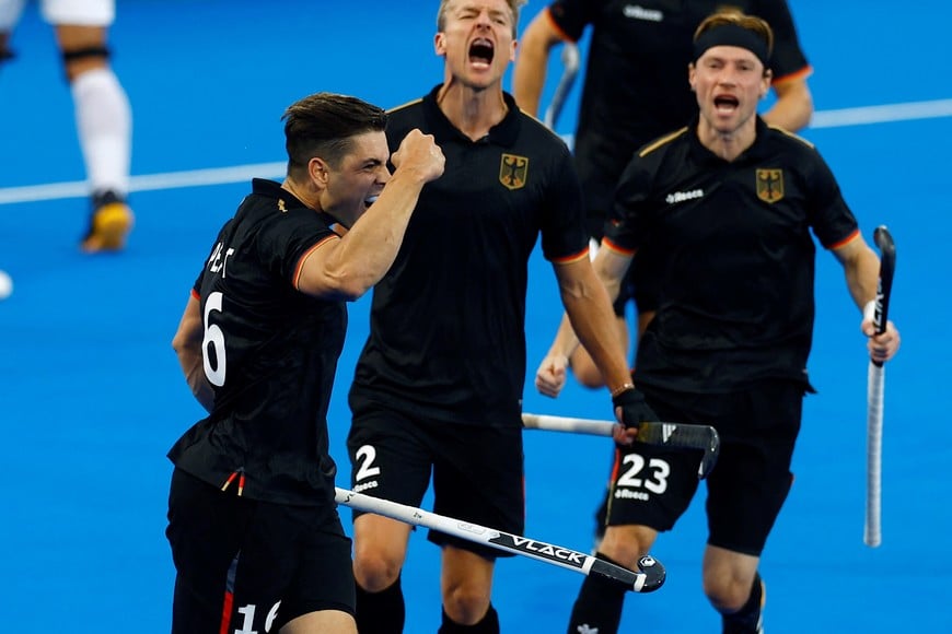 Paris 2024 Olympics - Hockey - Men's Quarter-final - Germany vs Argentina - Yves-du-Manoir Stadium, Colombes, France - August 04, 2024.
Gonzalo Peillat of Germany, Mathias Mueller of Germany and Martin Zwicker of Germany celebrate their second goal. REUTERS/Anushree Fadnavis