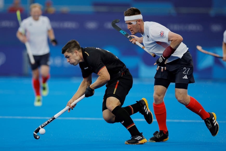 Paris 2024 Olympics - Hockey - Men's Pool A - Great Britain vs Germany - Yves-du-Manoir Stadium, Colombes, France - August 02, 2024.
Gonzalo Peillat of Germany in action with Liam Sanford of Britain. REUTERS/Anushree Fadnavis