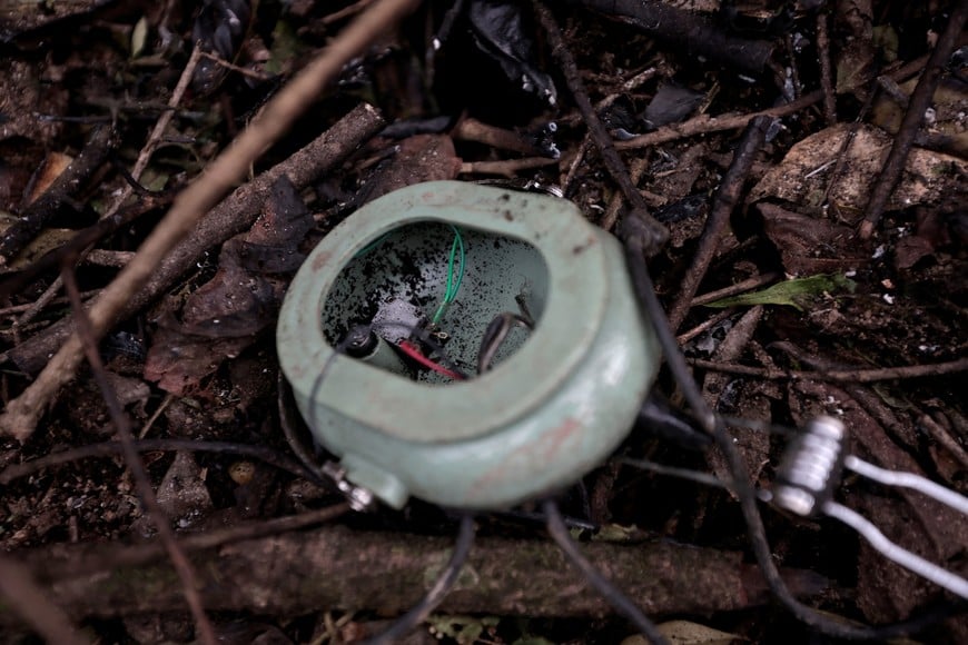 A close-up view of a damaged headphone is pictured amidst the rubble at the site of a helicopter crash on the outskirts of Kathmandu, Nepal, August 7, 2024. REUTERS/Navesh Chitrakar