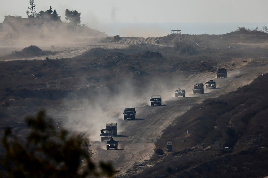 An Israeli military convoy moves inside the Gaza Strip, amid the ongoing conflict between Israel and Hamas, as seen from Israel, August 14, 2024. REUTERS/Amir Cohen