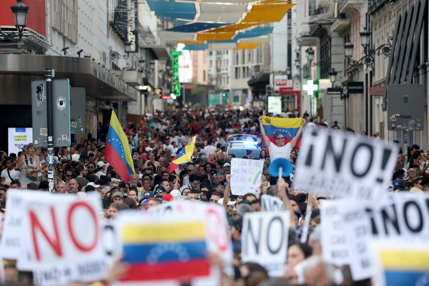 Venezuelans living in Spain take part in a global protest against election results in their home country, in Madrid, Spain, August 17, 2024. REUTERS/Isabel Infantes