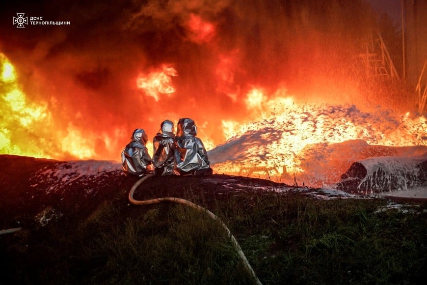 Firefighters work at a site of an infrastructure facility hit by a Russian drone strike, amid Russia's attack on Ukraine, in Ternopil region, Ukraine August 20, 2024. Press service of the State Emergency Service of Ukraine/Handout via REUTERS ATTENTION EDITORS - THIS IMAGE HAS BEEN SUPPLIED BY A THIRD PARTY.